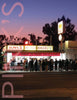 A crowd waits at dusk outside Pink’s, a renowned chili dog and burger stand, featured in Southern California Eats 2 by Schiffer Publishing, Ltd.—an iconic example of the vintage diners that define Los Angeles’s historic food scene.