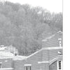 A black-and-white photo of a brick building and leafless trees evokes the chilling tales found in "Fright to the Point: Ghosts of West Point" from Schiffer Publishing, Ltd., exploring eerie legends like those of Benedict Arnold and Major Andre.