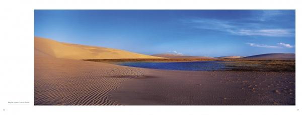 Discover the tranquil beauty of sandy dunes and blue lagoons featured in "Seven Continents" by Schiffer Publishing, Ltd.—a must-have for landscape photography enthusiasts seeking remote, serene destinations.
