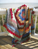 The Recycled Hexie Quilts from Schiffer Publishing, Ltd. add vintage charm to any porch, their graceful hexagon patterns inspiring fresh quilt design ideas in the gentle afternoon light.