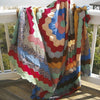 The Recycled Hexie Quilts from Schiffer Publishing, Ltd. add vintage charm to any porch, their graceful hexagon patterns inspiring fresh quilt design ideas in the gentle afternoon light.