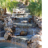 Swimming Pool Innovations by Schiffer Publishing, Ltd. features cascading waterfalls over stone steps, rocks, and palms, ending in a clear pool, with sunlight filtering through fronds—perfect inspiration for your backyard swimming pool paradise.