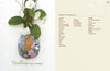 Inspired by gourd painting, "Creating Wall Pockets" by Schiffer Publishing, Ltd. features an egg-shaped pocket painted with pink roses, green leaves, and a bird at a birdhouse. It holds greenery and white flowers; instructions and materials are provided.