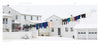 Seasons of Lancaster County by Schiffer Publishing, Ltd. captures the charm of colorful laundry on a clothesline between snowy white houses, a bicycle by a railing, and a white garage in Lancaster County's four seasons.