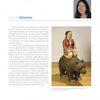 A page from 100 Boston Artists by Schiffer Publishing, Ltd. spotlights Sachiko Akiyama, featuring her portrait, her wooden sculpture "Aviator Akiyama" (2009), and an overview of her impact on Boston’s art scene.