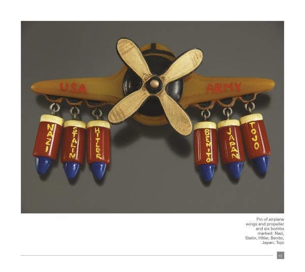 This WWII Bakelite Jewelry by Schiffer Publishing, Ltd. features a patriotic airplane pin with a gold "USA" and "ARMY" propeller and six bombs labeled: NAZI, STALIN, HITLER, BENITO, JAPAN, and TOJO.