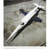 A white NASA X-3 with a pointed nose is parked on concrete as two people stand by the cockpit, emphasizing NASA's aerospace research. "NASA: Space Flight Research and Pioneering Developments" by Schiffer Publishing, Ltd. is captioned above and below.