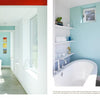 A modern bathroom with blue and white walls, a freestanding tub, and natural light showcases innovative home design as seen in "Contemporary Boston Architects" by Schiffer Publishing, Ltd.