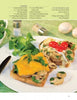 Two slices of toasted bread with pork tenderloin, mushrooms, herbs, and cheese, garnished and served with salad—an ideal dish from "Today I Cook" by Schiffer Publishing, Ltd. for simple recipes perfect for any men's cookbook.