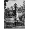 Decorative Ironwork of Italy" by Schiffer Publishing, Ltd. showcases black and white photos of ornate, hand-wrought iron gates with scrollwork, framed by stone pillars at villa gardens, with trees and statues in the background.