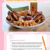 Enjoy a plate of chicken wings and fries served with ketchup, with a cheerful bear above the fries—perfect for fans of interactive cooking fun. "Cooking Together" by Schiffer Publishing, Ltd. brings culinary games to life!.