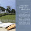 A large gray house stands on a grassy hill above a sandy beach with colorful kayaks and boats. To the right, find Schiffer Publishing, Ltd.'s "101 Things to Do in Martha's Vineyard," a guide for exploring local attractions.