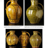 Four Wood-Fired Ceramics by Schiffer Publishing, Ltd. are displayed against a black background, each featuring unique earthy glazes and patterns that highlight skilled craftsmanship and diverse kiln techniques.