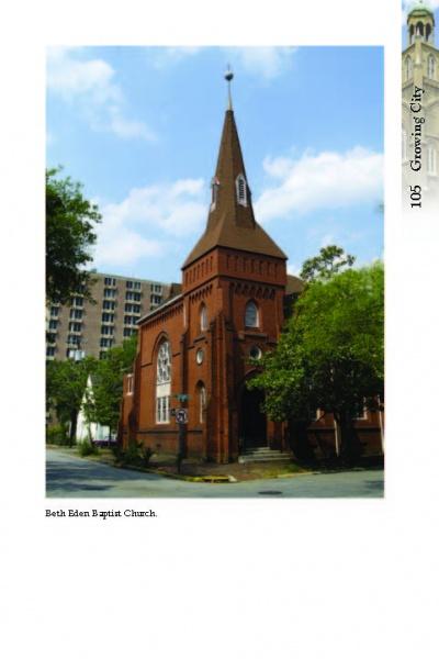 A striking red brick church with a tall steeple and arched windows stands on a corner, reflecting Savannah's historic charm. Featured in "Savannah Architectural Tours" by Schiffer Publishing, Ltd., it’s a must-see on any city stroll. Text: Beth Eden Baptist Church.
