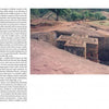 Seen from above, a person gazes at a large stone church carved into the earth with a cross-shaped roof, a stunning example of subterranean architecture—just like the fascinating explorations in Notes from the Underworld by Schiffer Publishing, Ltd.