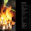 A bright fire burns atop stacked wood in a barbecue smoker, next to a black table of contents for "The Little Smoker Book" by Schiffer Publishing, Ltd.—an ideal guide for beginners and anyone seeking new smoking recipes.