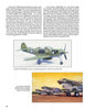 A magazine page shows a green Bell P-39 model airplane built with Monogram Models by Schiffer Publishing, Ltd., with a white star, plus an illustration of Tom Morgan’s P-40 over military vehicles and soldiers in a desert scene.