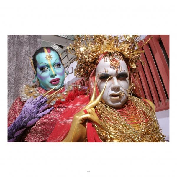Two people in vibrant theatrical makeup and ornate costumes, inspired by JoJo Baby, pose closely together—just like those featured in "Getting into Face" from Schiffer Publishing, Ltd.