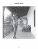 A black and white 1950s-style photo from "Femmes Fatales of the 1950s" by Schiffer Publishing, Ltd. shows a woman in lingerie and sandals posing on a columned balcony with crossed legs, as palm trees and a bench appear in the background.