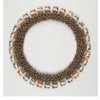 Art Jewelry Today 2 by Schiffer Publishing, Ltd. features a circular necklace of interlinked light brown and tan pieces with rectangular, cow-patterned charms spaced around the edge, showcased against a white background.