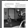 A woman sits on a bed with a notebook as a man films her in a dimly lit room. Text overlays describe an interview about "EVP: Electronic Voice Phenomenon" by Schiffer Publishing, Ltd., exploring ghost-related EVP in Massachusetts.