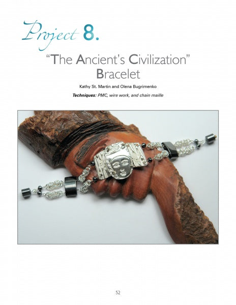 A bracelet with an ancient face centerpiece, black and silver beads, and intricate designs is displayed on a wooden hand. Text above reads, “Mixed Media Jewelry Techniques” by Schiffer Publishing, Ltd.—unique jewelry designs showcased.