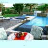 A luxurious backyard from Schiffer Publishing, Ltd.’s *The Sustainable Landscape* features a pool, spa, and patio, with eco-friendly, water-efficient landscaping around a round table with fruit and patterned chairs in the foreground.