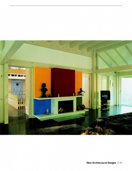 A modern living room features a minimalist, functional Fireplaces design by Schiffer Publishing, Ltd., with bold yellow, red, and blue color blocks. Sculptures and decor on the mantel are highlighted by sunlight from large windows.