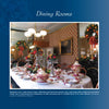 A formal dining room adorned with festive décor inspired by "Delicious Christmas Decorations at Historic Houses and Your Home" by Schiffer Publishing, Ltd., featuring dried fruit wreaths, ornate tableware, patterned wallpaper, and elegant mirrors.
