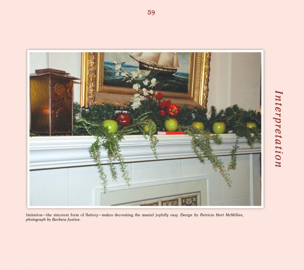A mantel decorated with green garland, red and green ornaments, apples, a lantern, and a ship painting above evokes “Delicious Christmas Decorations at Historic Houses and Your Home” by Schiffer Publishing, Ltd.; Interpretation appears vertically at right.
