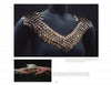 A close-up shows a sculptural necklace with copper and iron scales in a V shape; an inset depicts hands holding similar wearable art. Featured in "Art Jewelry Today 3" by Schiffer Publishing, Ltd.