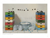 Inspired by Robert C. Jackson Paintings from Schiffer Publishing, Ltd., this scene features stacked colorful crates, Oreo cookies on strings, floating cookies in a metal tub, blue bottle caps, and empty milk jugs on white tiles.