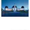 Griffith Observatory at dusk glows against a blue sky, with its monument and lawn in front. Visitors gather near the domes, enjoying this Southern California icon featured in Schiffer Publishing, Ltd.'s "Southern California Out & About.