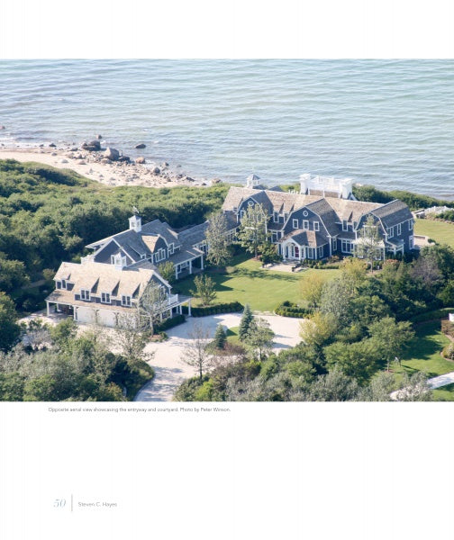 An aerial view from "United by Design" by Schiffer Publishing, Ltd. shows two large gray-shingled Cape Cod homes, set among greenery and landscaped lawns, with a driveway and shoreline waves in the background.