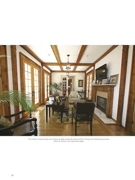 A bright living room from Old Places, New Spaces by Schiffer Publishing, Ltd. features wooden beams, glass doors, a fireplace, and framed décor on the mantel, evoking the charm of San Antonio’s historic homes as sunlight streams in.