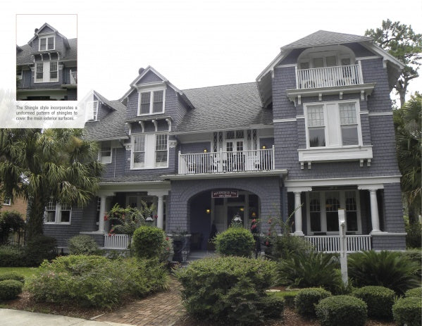 A large gray shingle-style house with white trim, featured in "Florida's Historic Victorian Homes" by Schiffer Publishing, Ltd., showcases multiple gables, balconies, palm trees, a covered front porch, and detailed upper shingles.