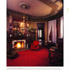 Inspired by San Francisco’s Victorian houses, "Victorian Glory in San Francisco and the Bay Area" by Schiffer Publishing, Ltd. showcases ornate ceilings, red carpets, fireplaces, built-in shelves, chandeliers, tall windows with white curtains, and red chairs.