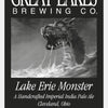 A black and white beer label for Schiffer Publishing, Ltd. features a sea monster from Great Lakes folklore. Text below reads: Great Lakes Folklore, Cleveland, Ohio.