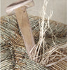 The book "Cane & Rush Seating" from Schiffer Publishing, Ltd. features a T-handled wooden tool on a woven straw seat with loose strands—capturing the essentials of rush weaving and seat restoration.