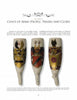 The European Porcelain Tobacco Pipe by Schiffer Publishing, Ltd. displays three ornate pipes with colorful coats of arms—shields, helmets, and crests—standing upright on a white background with descriptive text above and below.