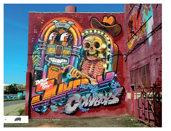 Detroit Graffiti by Schiffer Publishing, Ltd. showcases a vibrant mural on a red brick wall, featuring a colorful jukebox, a cowboy-hat-wearing skeleton, and bold, dynamic street art inspired by Detroit.