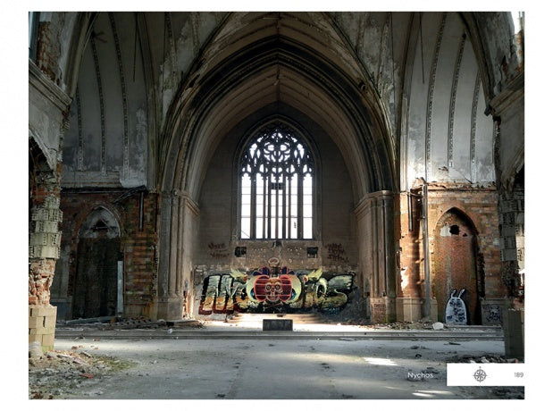 The interior of an abandoned church with high arched ceilings and broken walls features "Detroit Graffiti" art—colorful lettering and a skull—on the back wall beneath a large stained-glass window. Brand: Schiffer Publishing, Ltd.