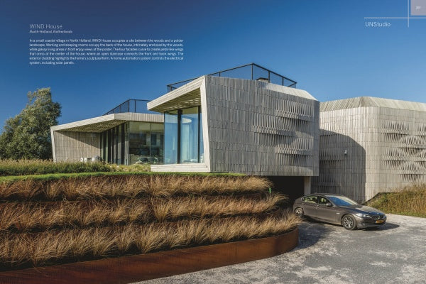 Modern Masters by Schiffer Publishing, Ltd. features a modern house with angular gray-paneled walls, large glass windows, tiered grassy landscaping, and a gray car in the driveway under a sunny blue sky, highlighting innovative architecture.