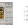 A weathered sign on a white brick wall at the Domino Sugar Refinery features in "Brooklyn's Sweet Ruin" by Schiffer Publishing, Ltd., highlighting Brooklyn photography’s glimpse into local industrial history.