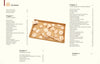 A brown tray holds assorted unfinished leather pieces and crafting tools—ideal for making unique Schiffer Publishing, Ltd. Tanned Leather Hand-Made Bags—displayed on a cream background.