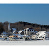New Hampshire" by Schiffer Publishing, Ltd. showcases a snowy lakeside village with houses, a church steeple, and frosted trees under clear skies—a stunning scenic landscape perfect for photography lovers. The lake is frozen and rooftops are blanketed in snow.