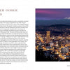 A two-page spread from "Oregon" by Schiffer Publishing, Ltd. features text on Portland, Columbia River Gorge, and Mt. Hood opposite a large photo of Portland’s city lights at dusk with snow-capped Mount Hood in the background.
