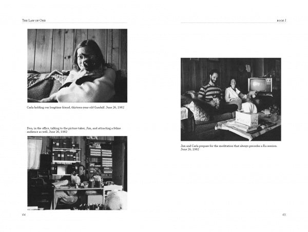 Black and white photograph from the Law of One series showing two individuals seated, possibly engaging in a conversation or presentation related to the material.
