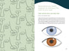 A spread from "Health through Your Eyes" by Schiffer Publishing, Ltd. shows an abstract face on the left and health advice on eye color on the right, with illustrated blue and brown eyes and text on iris pigmentation and iridology.