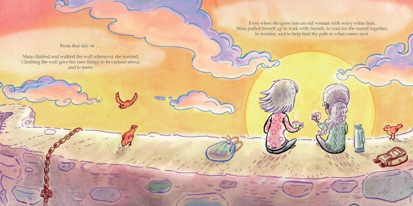 At sunset, two girls from "Maia and the Very Tall Wall" by Schiffer Publishing, Ltd. share a drink on a stone wall with a backpack and bottle nearby, their laughter inspiring kids to value friendship in a storybook-like scene.